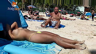 girl walking on the beach without bikini